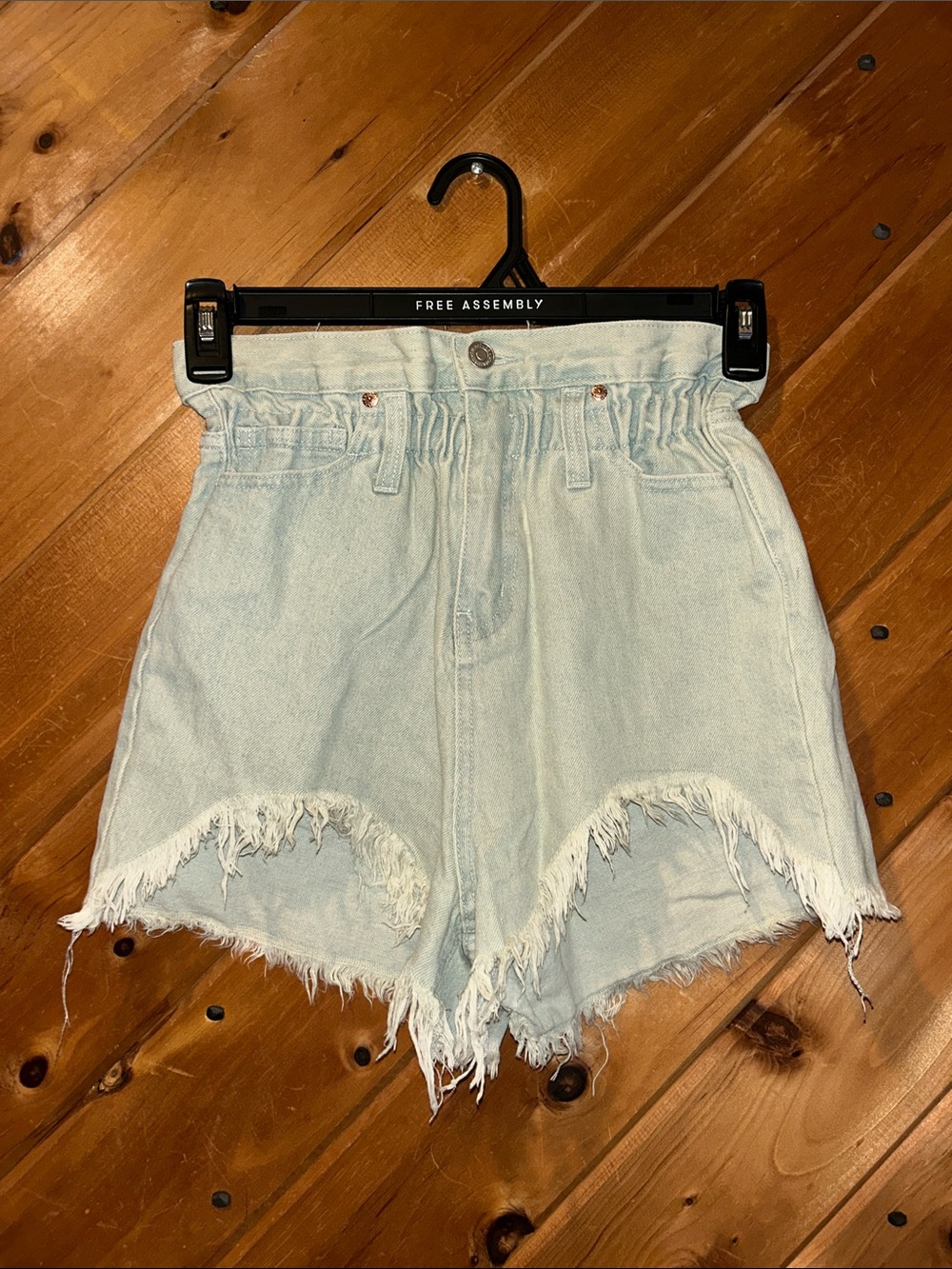 Rowen light-wash paperbag waist upward curve raw hemline denim shorts